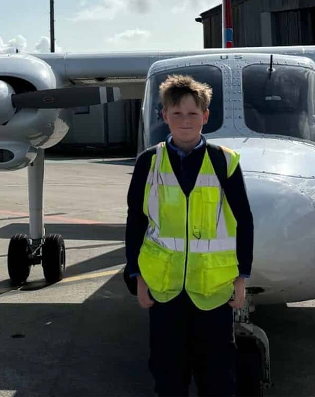 Harry standing infront of a Skybus Islander aircraft at Land's End Airport