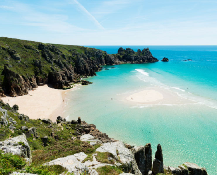 Soft sands and clear turquoise sea at Penvounder Beach near Porthcurno in West Cornwall.