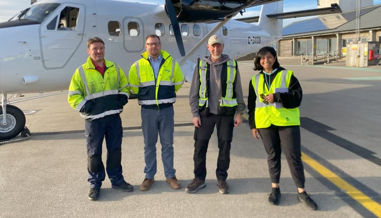 Ferry crew at Land's End Team engineering team in front of the new DHC-300 twin otter aircraft