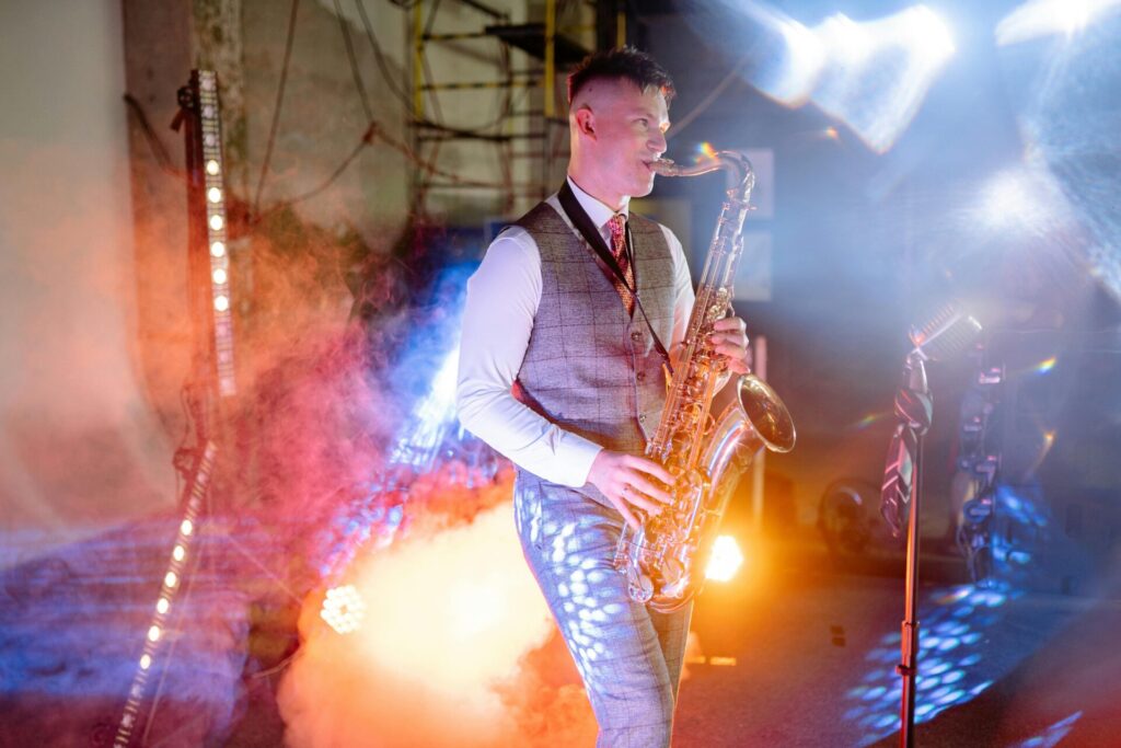 Male saxophonist on stage performing